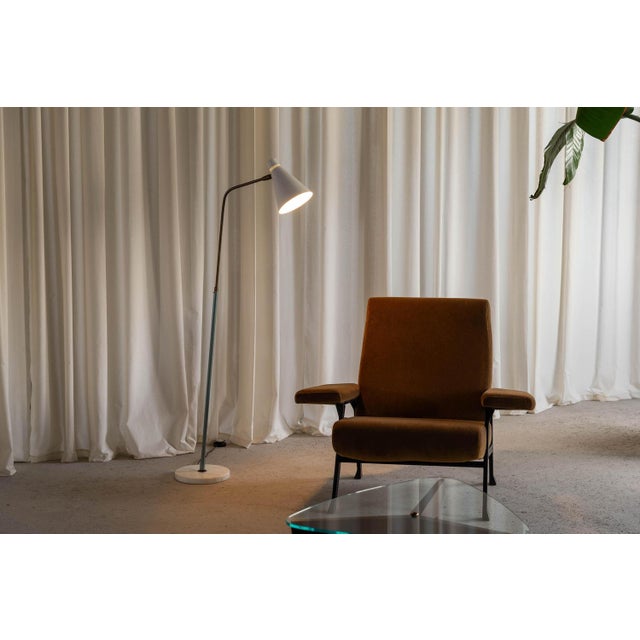 Rare reading lamp designed by giuseppe ostuni and manufactured by oluce in italy in 1953. This particular lamp is quite...
