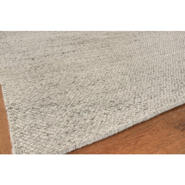 The Rhodes collection is a flatweave construction made of yarn dyed PET fibers. The subtle tweed appearance of the...