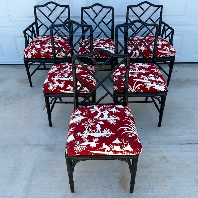 1970s Set of Six Black Chinese Chippendale Style Faux Bamboo Dining Chairs. These chairs are upholstered with a red and...