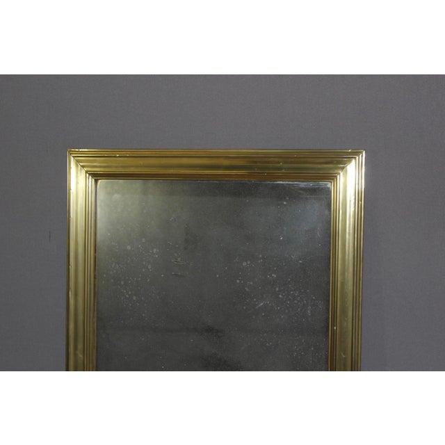 Brass bistro mirror with mercury glass, 19th century, in very good condition.