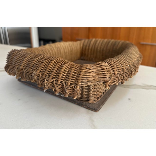 Unique handmade woven basket from the late 19th Century. Woven with vines and attached by wood dowels and handcrafted...
