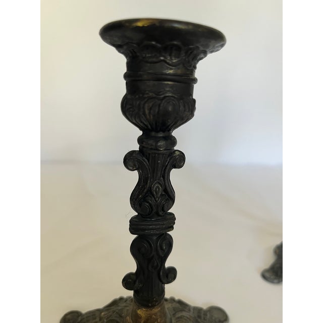 Bring timeless European elegance to your home with this beautiful pair of vintage solid brass candlestick holders,...
