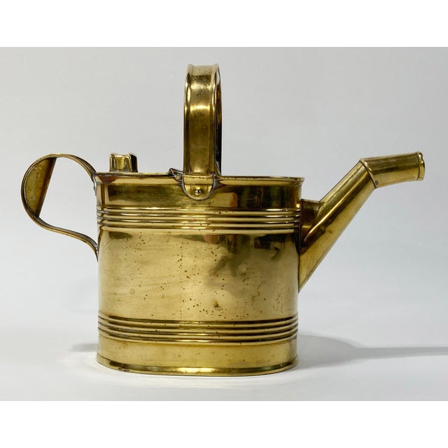 Heavy antique English brass watering can in classic architectural style. Doubles as a great vase or storage piece....