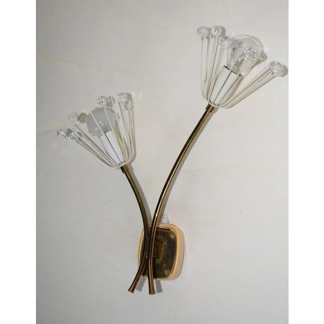 Beautiful wall lamp in perfect condition. I have official proof of authenticity such as vintage catalogs, designer...