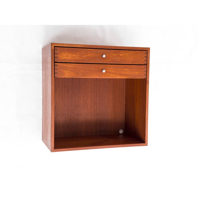 A high-quality teakwood nightstand, crafted with meticulous attention to detail, designed for wall mounting (two screws)....