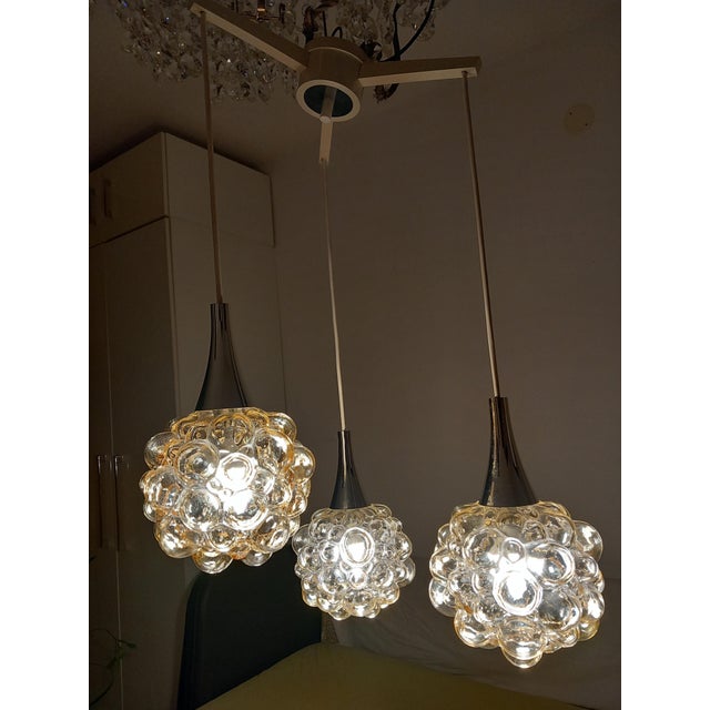 The cascade lamp is equipped with three E14 sockets; the glass globes are in mint condition. No damage whatsoever. Bulbs...