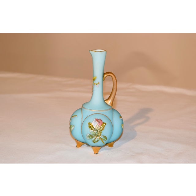 19th century satin glass cruet in a lovely blown form with applied glass handle and feet painted in gold. There are hand...