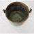 An antique French brass cooking pot with handle for suspending over the fire, dating to the second half of the 19th...