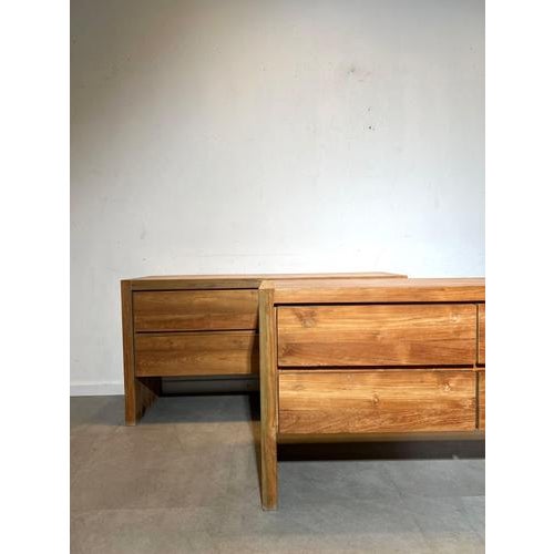 Minimalist brutalist sideboard crafted entirely from solid wood. The piece features a clean architectural silhouette with...