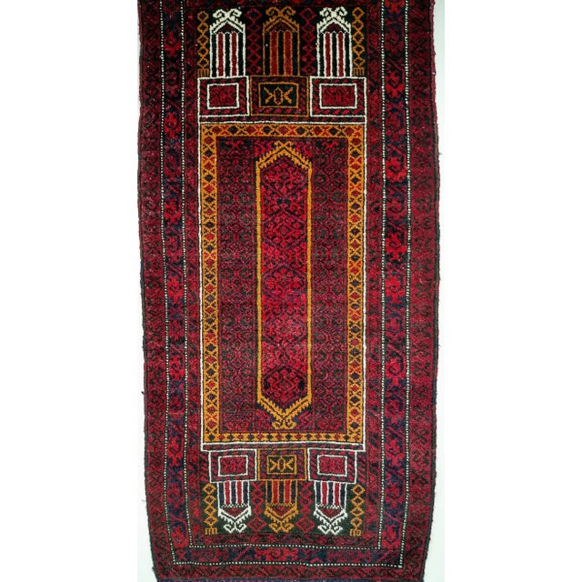 A Baluch Rug from Southwest Persia Dimensions: 1'8" x 3'8" Date of Manufacture: 3rd Quarter 20th Century Place of Origin:...