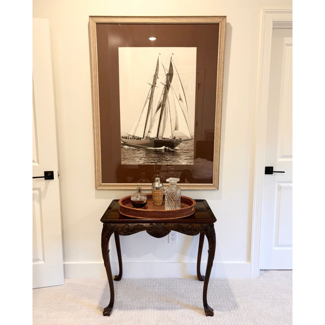 A mahogany tea table in the Chippendale style, unbranded with carving finished in order to be seen from all sides. In...