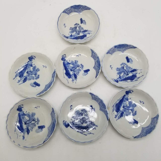 This set comprises seven small Japanese ceramic mame dishes crafted in the traditional Ko-Imari (early Imari) style,...