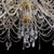 "Mariateresa" chandelier with thirty-eight lights on four orders in golden metal with glass arms, beads and drops. 20th...