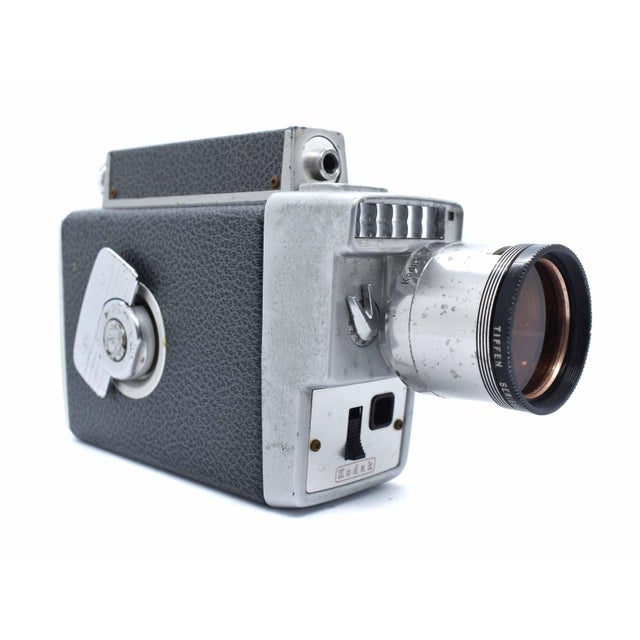 Capture the nostalgic charm of mid-century filmmaking with this vintage Kodak Zoom 8 Automatic 8mm movie camera. Produced...