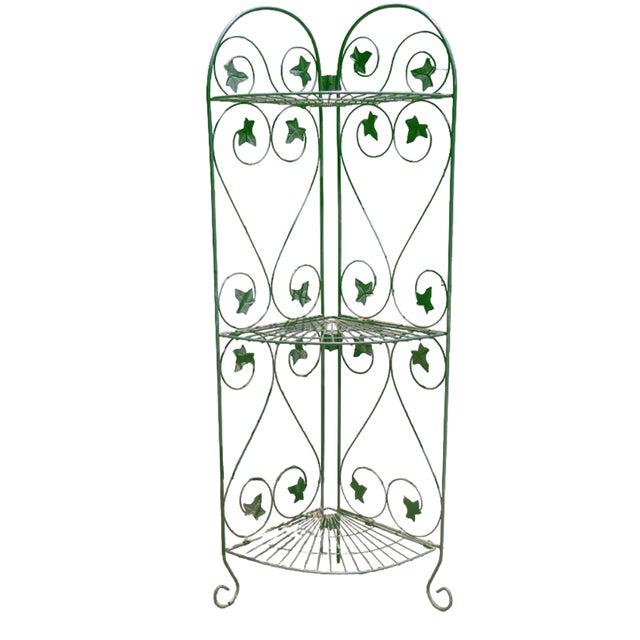 Pair of versatile green metal folding corner shelving units featuring a charming climbing ivy tole design reminiscent of...