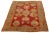 This Turkish Oushak rug is truly one of a kind! It is hand-knotted with soft wool and features a stunning red color field...