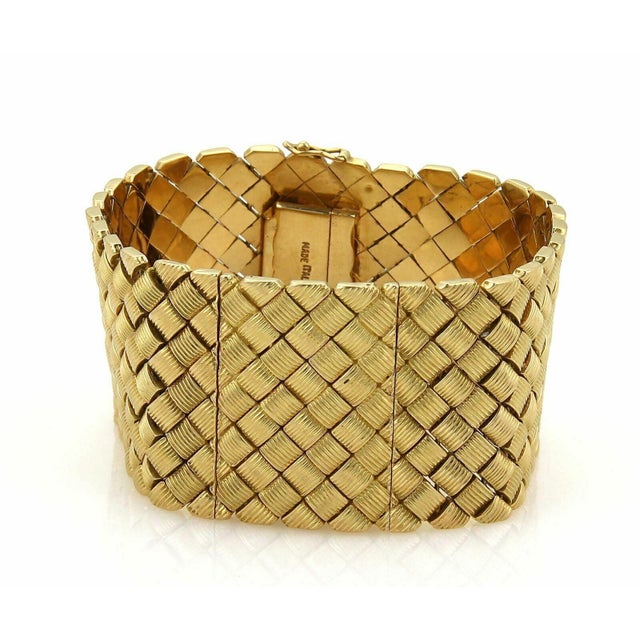 This is a stunning Retro Era wide watch bracelet, it is crafted from solid 18k yellow gold with a polished textured...