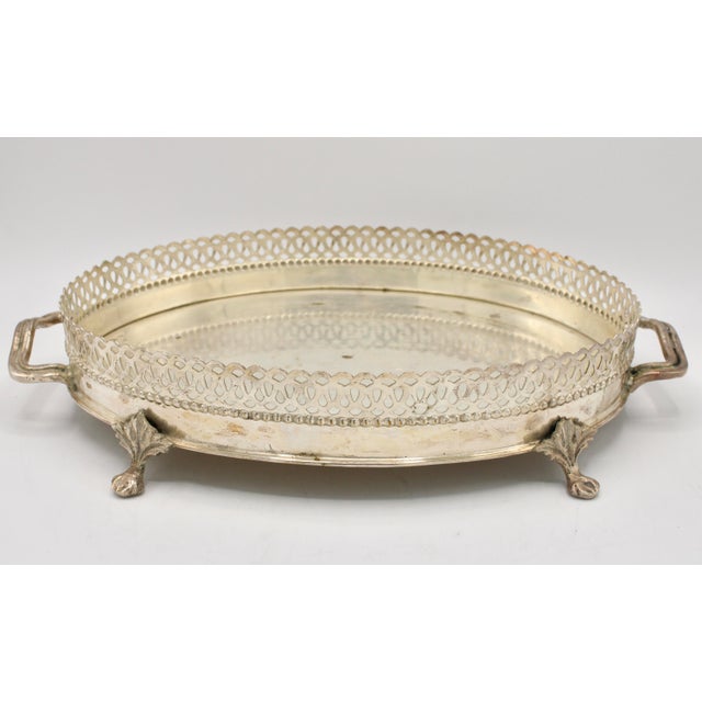 A stunning silver plate footed tray with a lovely pierced gallery and charming handles. This is a superb vintage silver...