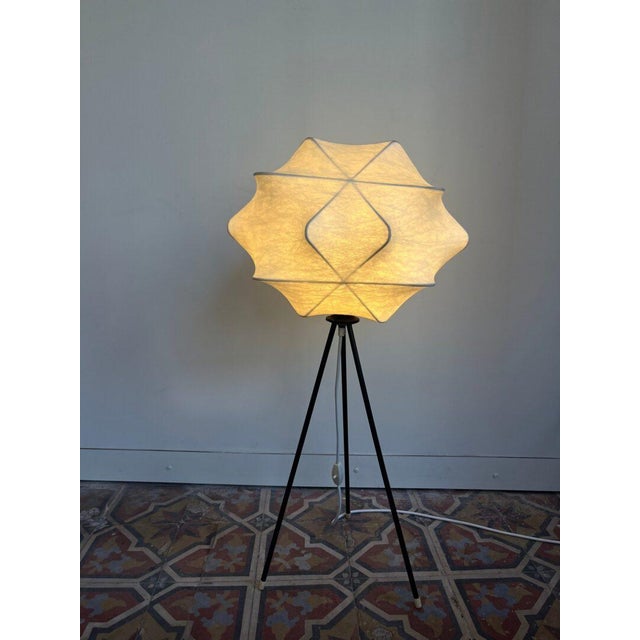 Rare cocoon floor lamp! The shade is made of sprayed fiberglass, creating a beautifully diffused and warm light effect....