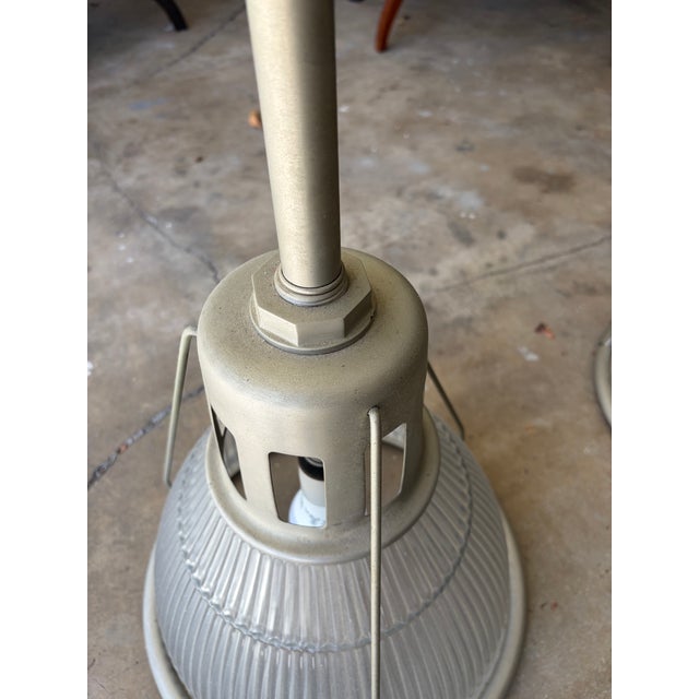 Vintage reproduction pendant light fixtures from high-end lighting designer Urban Archeology - these matte metal and reed...
