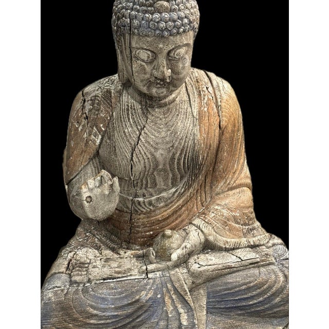 Large carved woof figure depicting the Medicine Buddha seated in meditation upon a double lotus throne. Retains extensive...