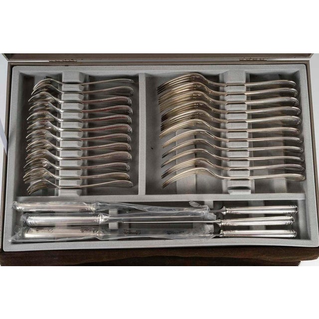 Large christofle service in original boxes. Christofle silver-plated cutlery service in two original boxes, 20th century,...