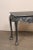 An English carved and painted wood console table with claw-and-ball feet. This vintage table from England has a...