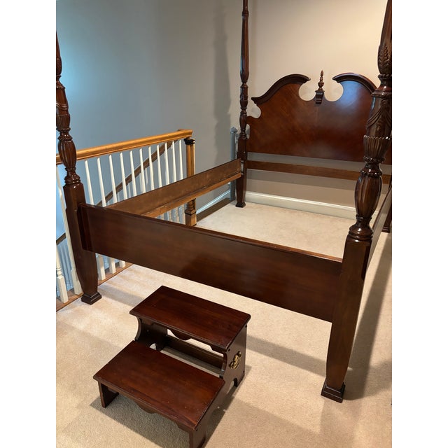 Beautiful good condition ,deep brownish red cherry wood elevated frame with stool Intricate rice style carvings on poster...