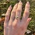 This exquisite ring is a stunning choice for any occasion. Featuring a 0.60 carat Demantoid, it is elegantly surrounded by...