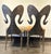 Pair of side custom made textured steel chairs with ram horn shaped backs. Seats upholstered in cowhide fur. Natural...