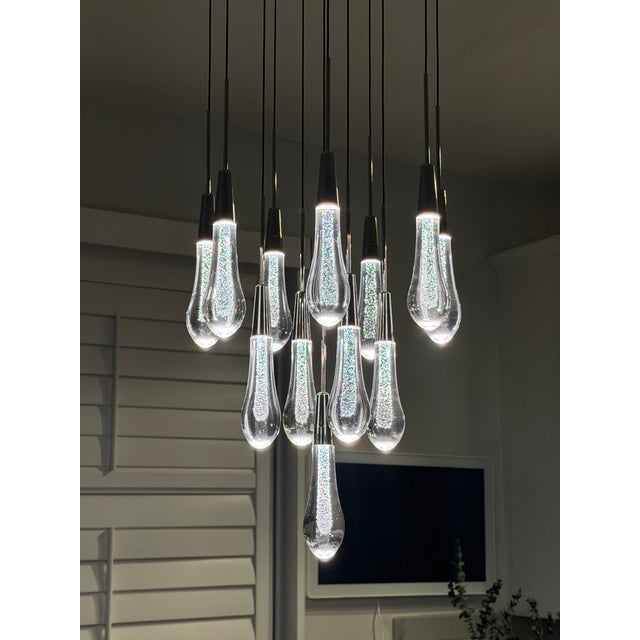 Each glass droplet is individually handcrafted, creating a stunning texture that catches and beautifully diffuses the...