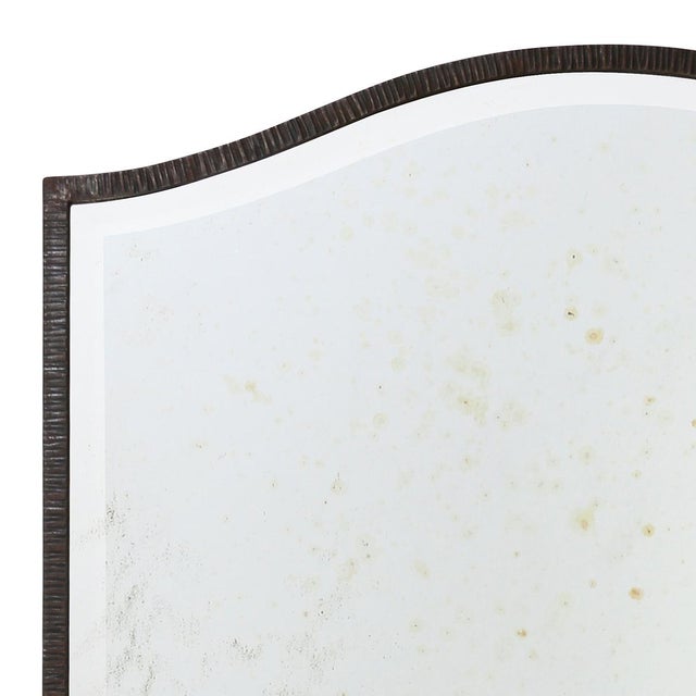 Paul Ferrante style, hand forged wrought iron mirror with a curved arch top frames this beveled floor mirror. The tall...