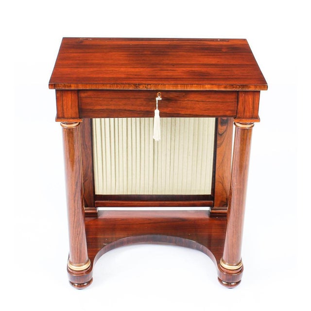 This is a beautiful small antique english empire gonçalo alves console with integral writing slide and pen drawer, circa...