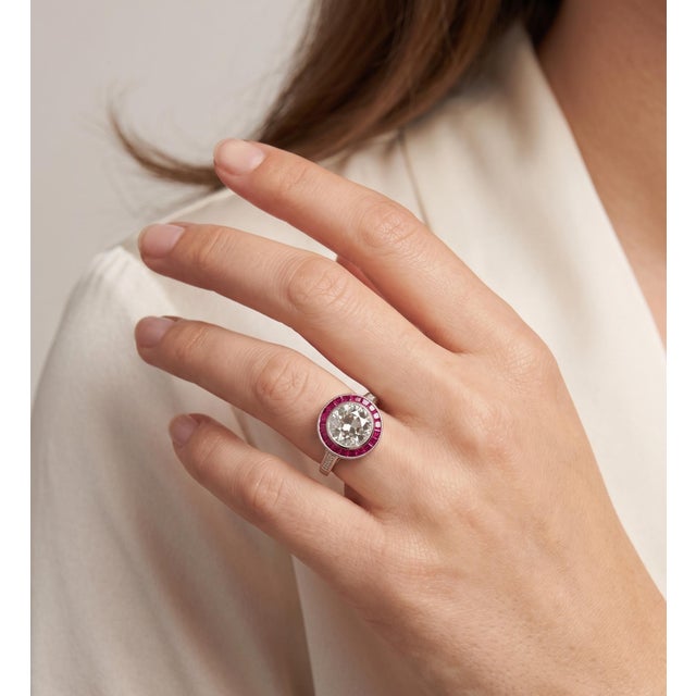 This exquisite Art Deco-style ring features a magnificent 3.17ct Old European cut diamond, boasting a bright H color and...