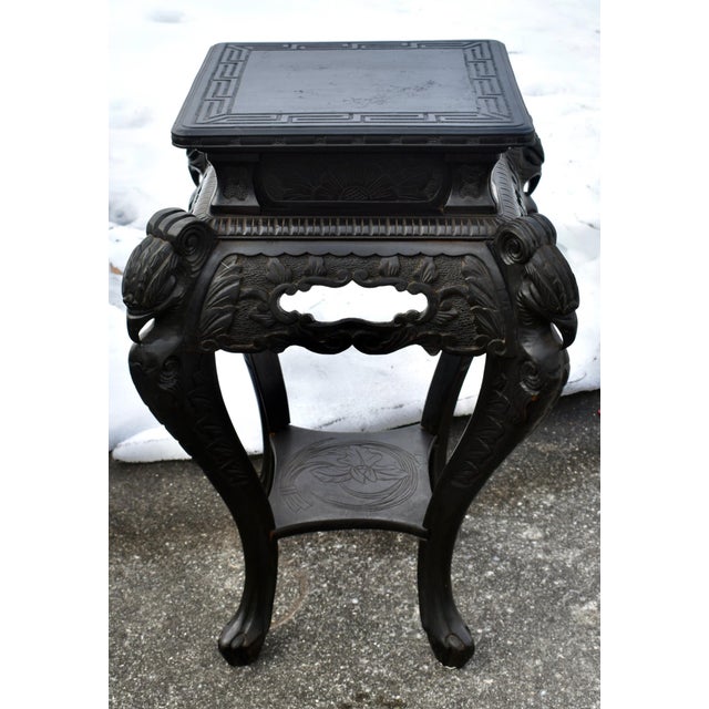 Antique (1920's) Two Tier Table is Chinese. Made of Wood. Carved Wood with Carved Birds. In a Black Finish. The...