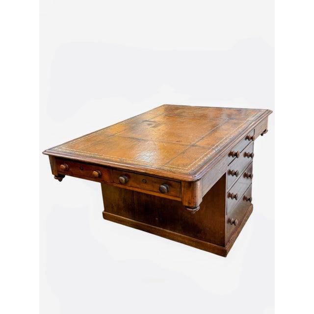Circa 1840. Having a fine leather top over charming pedestal at the center housing drawers with turned wood knobs. L...