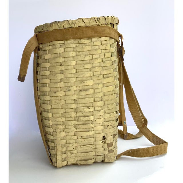 We found this in northern New York State in the Adirondack region, circa 1940s woven splint pack basket with original...