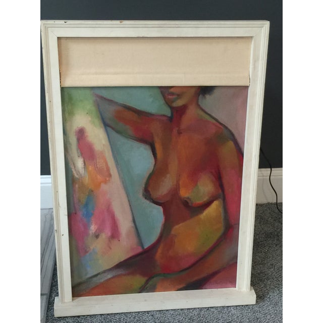 Interesting colorful abstract female nude holding a painting in a window frame. Signed and dated 1977, though the...