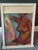 Interesting colorful abstract female nude holding a painting in a window frame. Signed and dated 1977, though the...