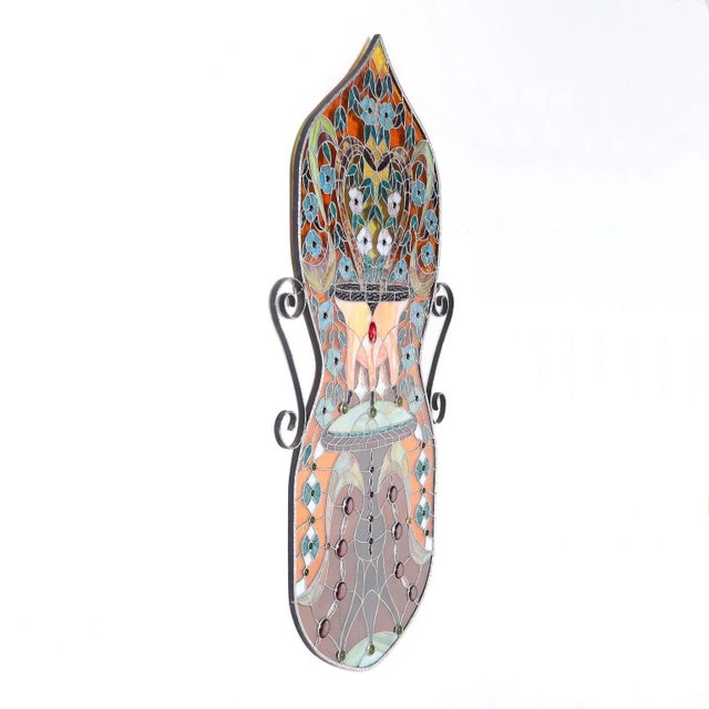 Striking stained glass panel hand crafted in an hourglass form in alluring vivid colors and highlighted with jewels in a...