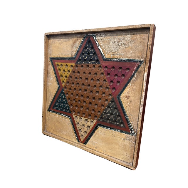 A sturdy c.19th Chinese checkerboard in original white with orange, blue, yellow and red paint. 17" x 17" x 1¼" A unique...