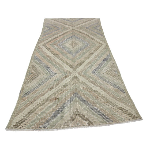 Embroidered Washed Out vintage kilim rug from Denizli region of Turkey. Approximately 50-60 years old. In very good condition