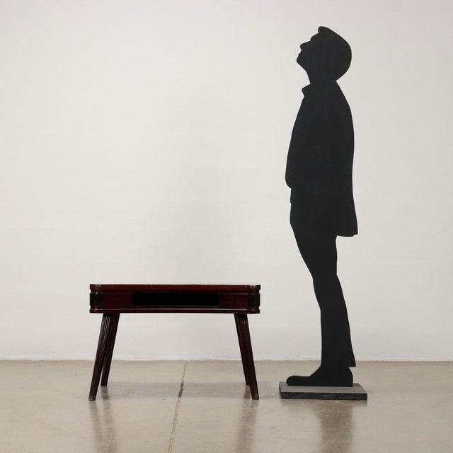 Coffee table with open compartment under the top in stained mahogany veneer with turned legs in stained beech wood. Good...