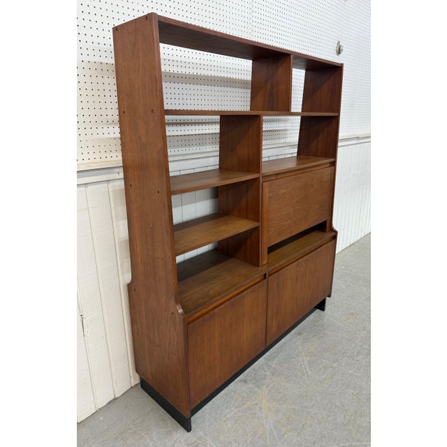 This listing is for a Mid-Century Modern Walnut Room Divider. Featuring a straight line design, drop down cabinet door,...