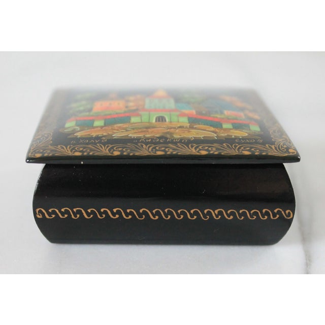 Vintage Russian hand-painted papier-mâché lacquer trinket box. It is a traditional Russian folk art form known as a...