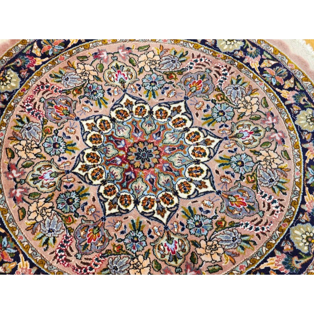 "A rare and exquisite round-shaped vintage Persian Tabriz rug from the early 20th century — an exceptional format that was...
