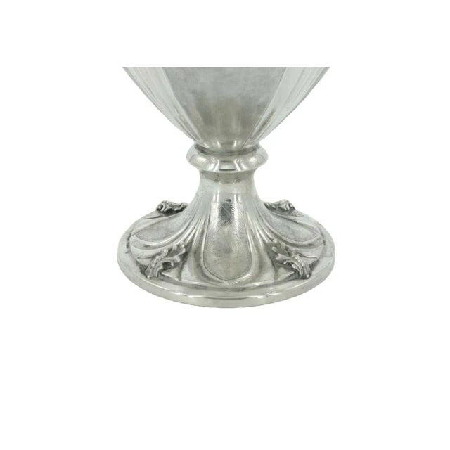 19th Century Italian sterling silver decorative vase with two side handles and exterior design details. The vase features...