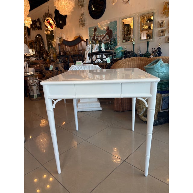 Vintage faux bamboo fret work game table with two drawers for game pieces, cards, etc. This is newly lacquered in a gloss...