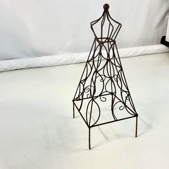 Offering a vintage Iron Garden Topiary Trellis Frame. It stands 21.5" tall after you push the 4 leg spikes into the...