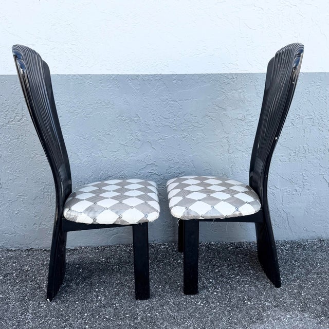 This striking set of five Art Deco dining chairs blends dramatic sculptural form with timeless elegance. Finished in a...